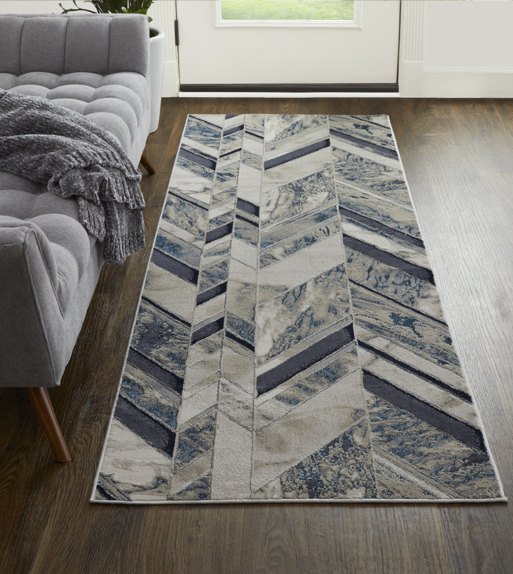 5' X 8' Ivory Blue And Gray Chevron Power Loom Distressed Area Rug