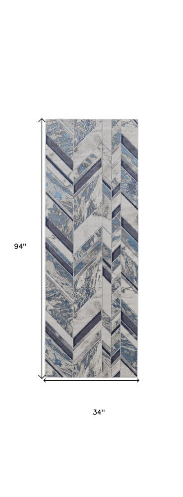 5' X 8' Ivory Blue And Gray Chevron Power Loom Distressed Area Rug