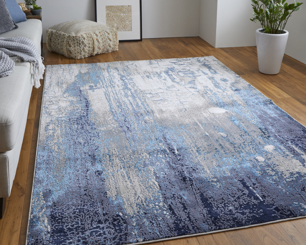 7' X 10' Ivory Blue And Black Abstract Power Loom Distressed Area Rug