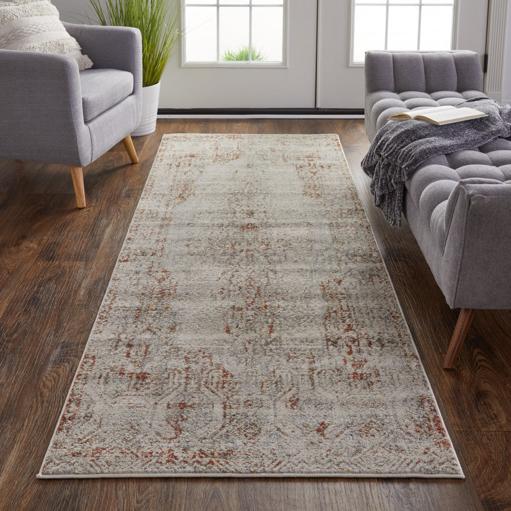 8' X 10' Tan Ivory And Orange Floral Power Loom Distressed Area Rug With Fringe