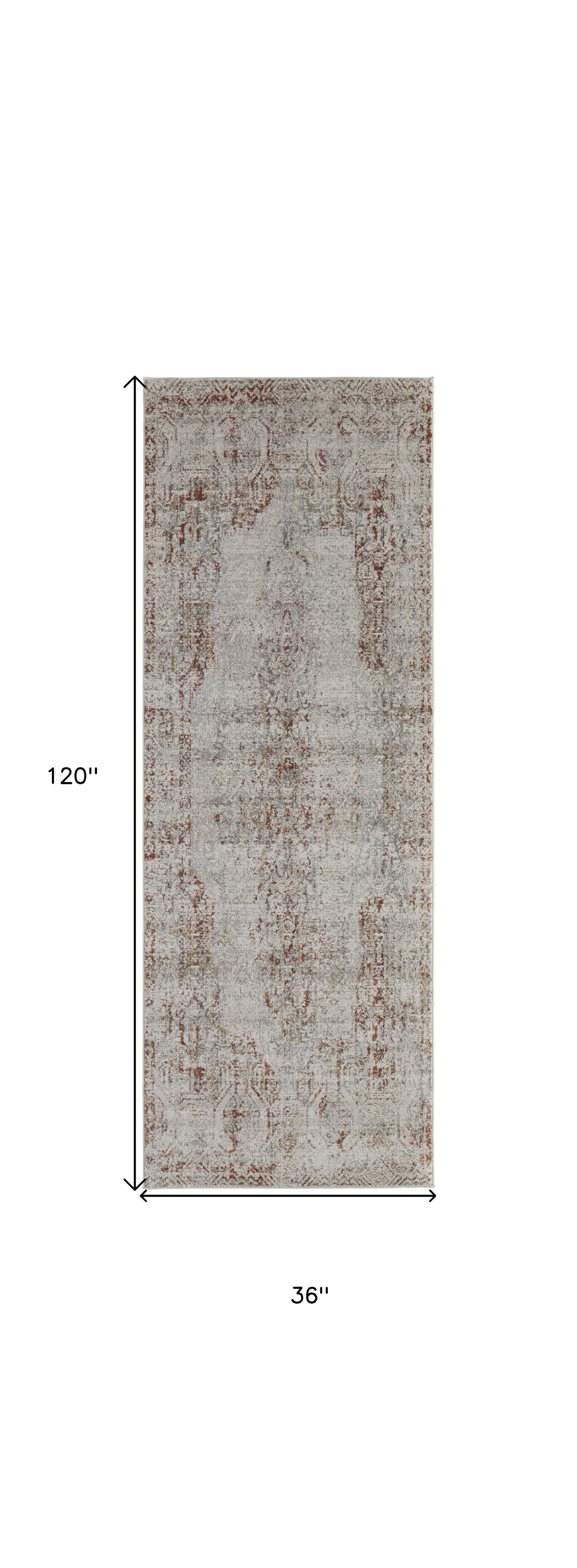 8' X 10' Tan Ivory And Orange Floral Power Loom Distressed Area Rug With Fringe