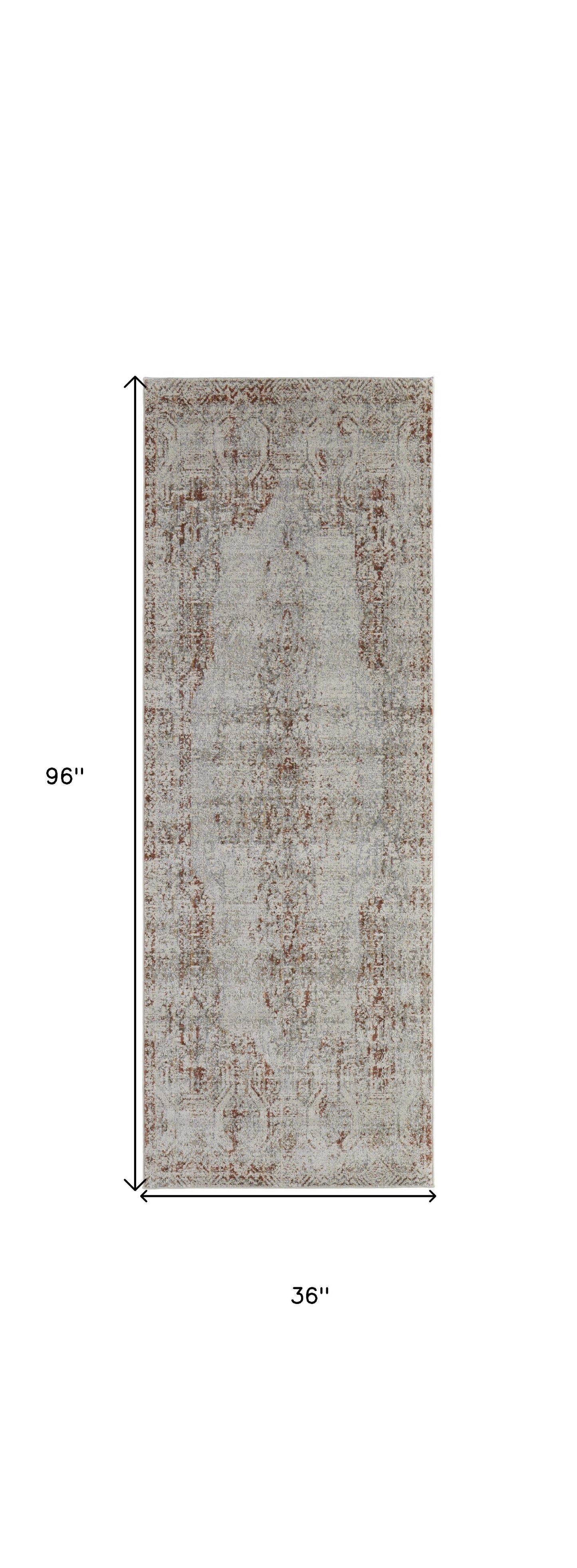 8' X 10' Tan Ivory And Orange Floral Power Loom Distressed Area Rug With Fringe