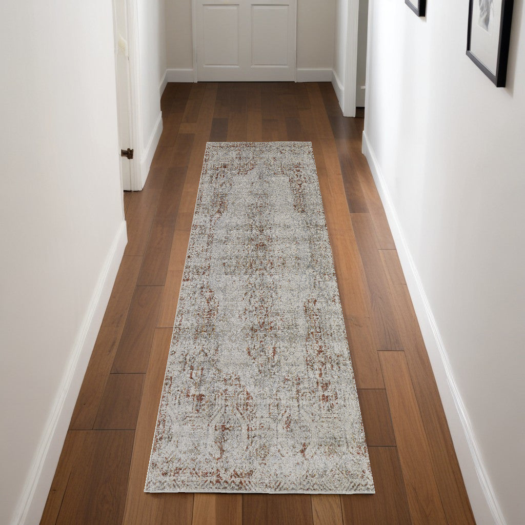 8' X 10' Tan Ivory And Orange Floral Power Loom Distressed Area Rug With Fringe