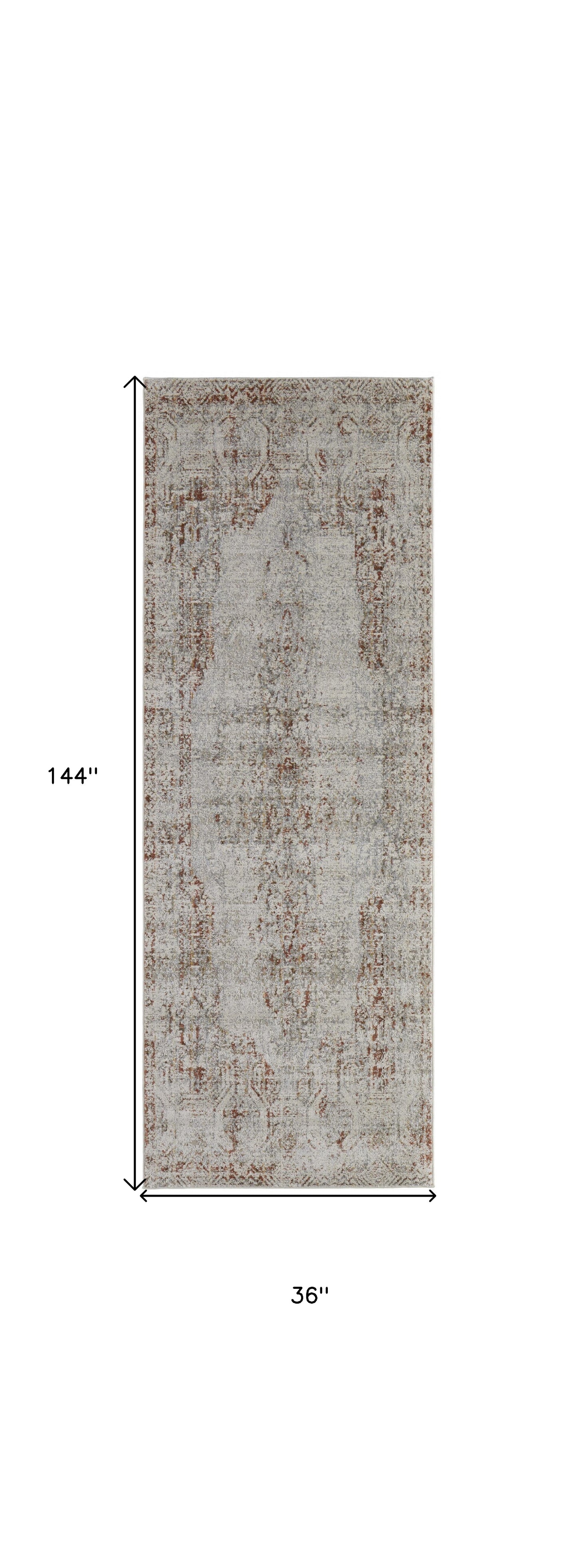 8' X 10' Tan Ivory And Orange Floral Power Loom Distressed Area Rug With Fringe