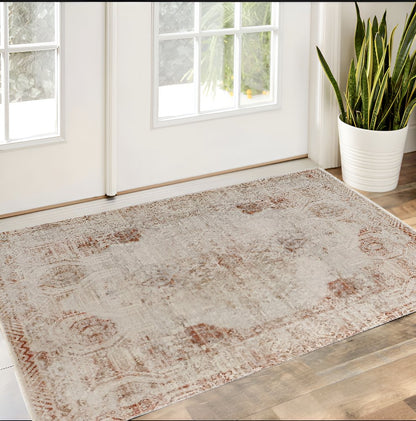 8' X 10' Gray Ivory And Burnt Orange Oriental Distressed Area Rug With Fringe