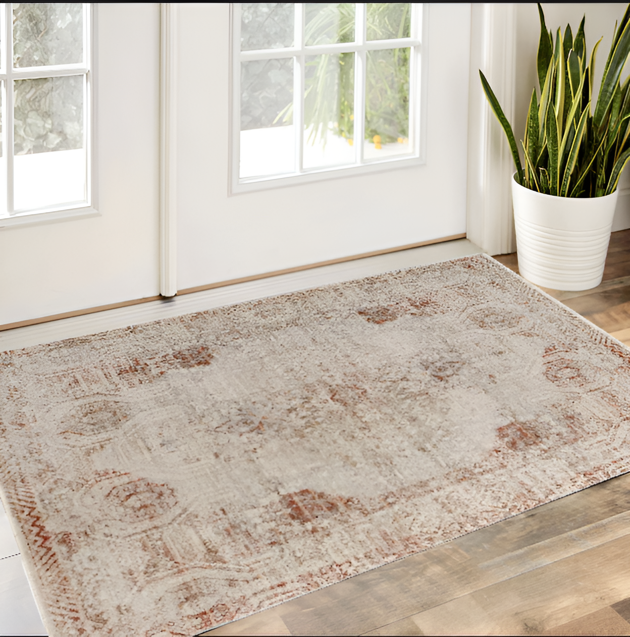 8' X 10' Tan Ivory And Orange Floral Power Loom Distressed Area Rug With Fringe