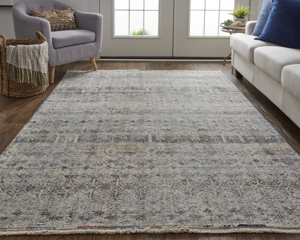 5' X 8' Tan Ivory And Blue Geometric Power Loom Distressed Area Rug With Fringe