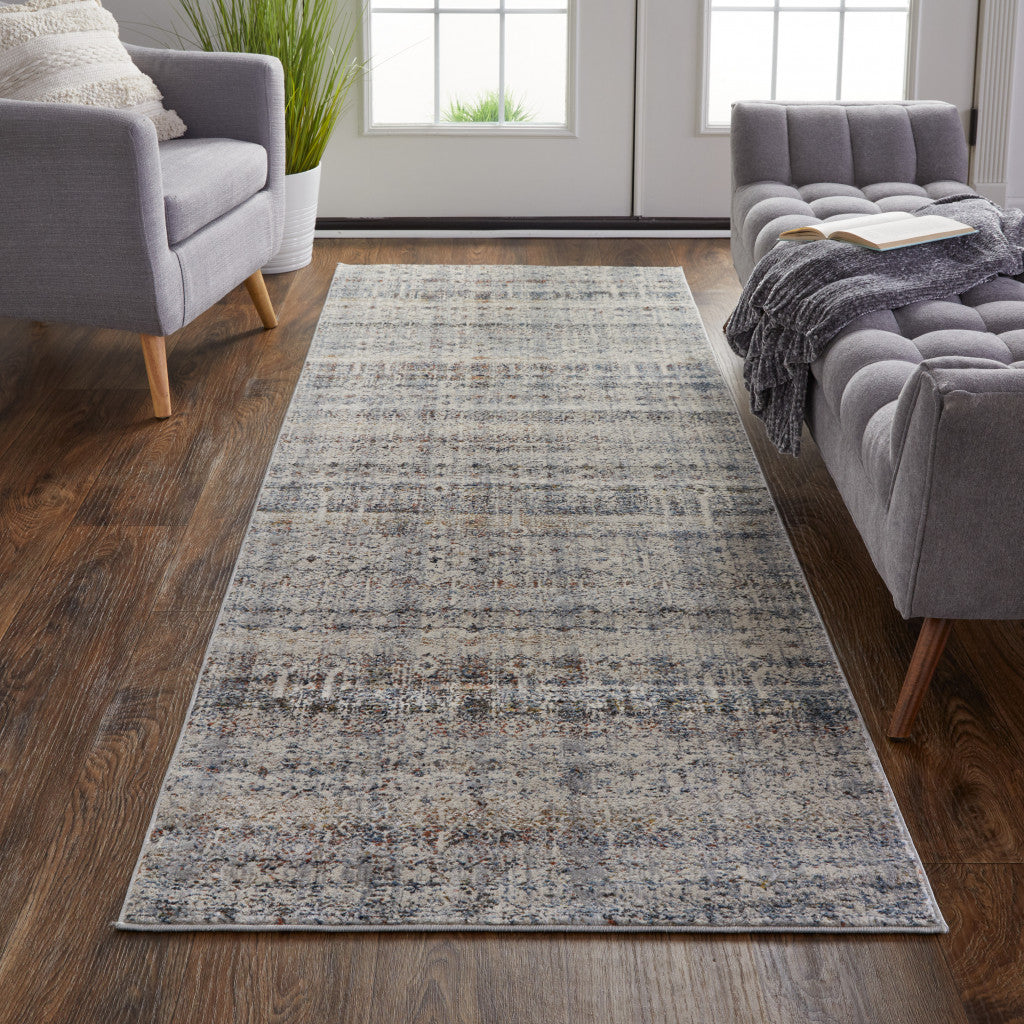 8' X 10' Tan Ivory And Blue Geometric Power Loom Distressed Area Rug With Fringe