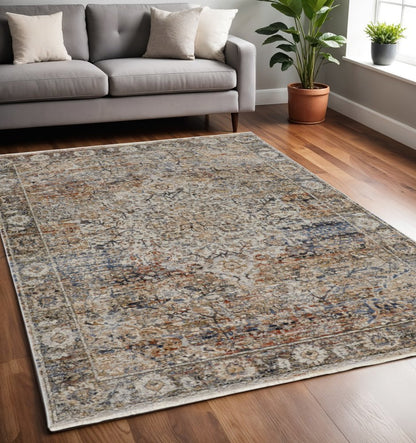 10' X 13' Tan Blue And Burnt Orange Oriental Distressed Area Rug With Fringe