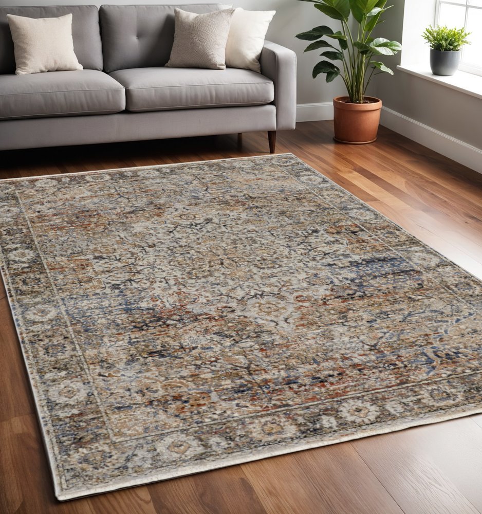 10' X 13' Tan Blue And Burnt Orange Oriental Distressed Area Rug With Fringe