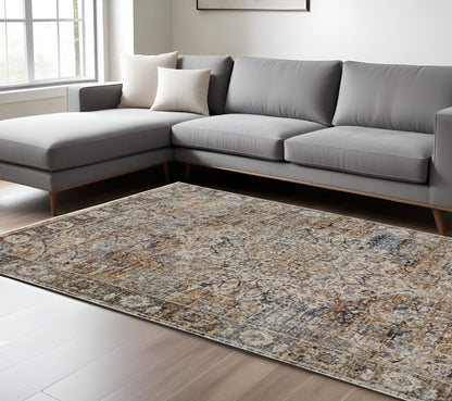 8' X 10' Tan Blue And Burnt Orange Oriental Distressed Area Rug With Fringe