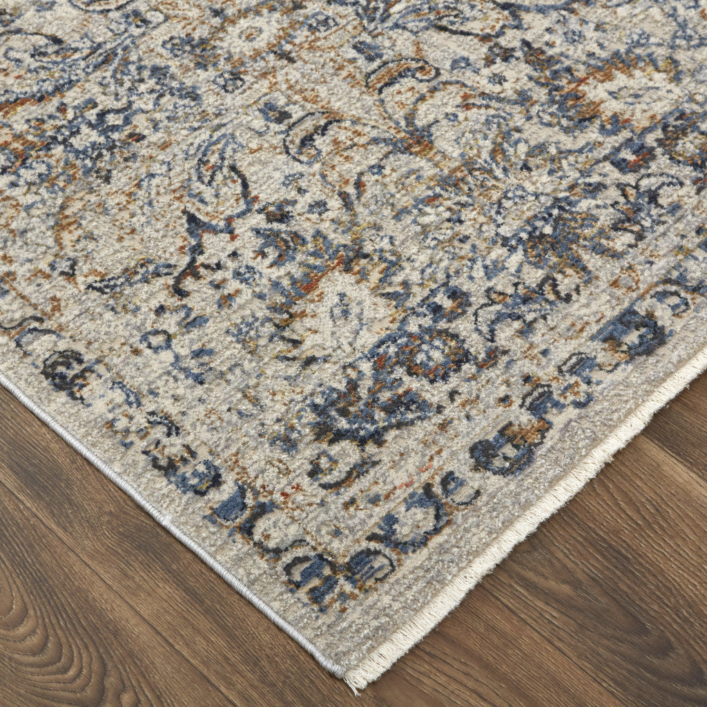 5' X 8' Tan and Blue Floral Power Loom Distressed Non Skid Area Rug With Fringe