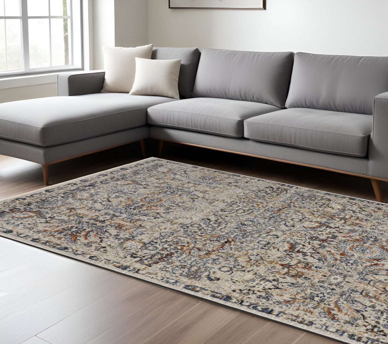 5' X 8' Tan and Blue Floral Power Loom Distressed Non Skid Area Rug With Fringe