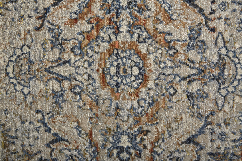 5' X 8' Tan Blue And Orange Floral Power Loom Distressed Area Rug With Fringe