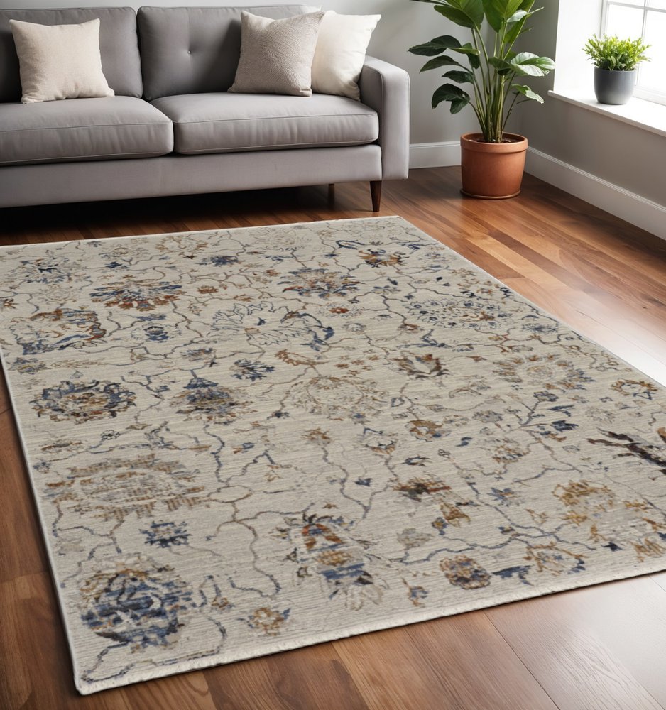 8' X 10' Ivory Blue And Burnt Orange Floral Distressed Area Rug With Fringe