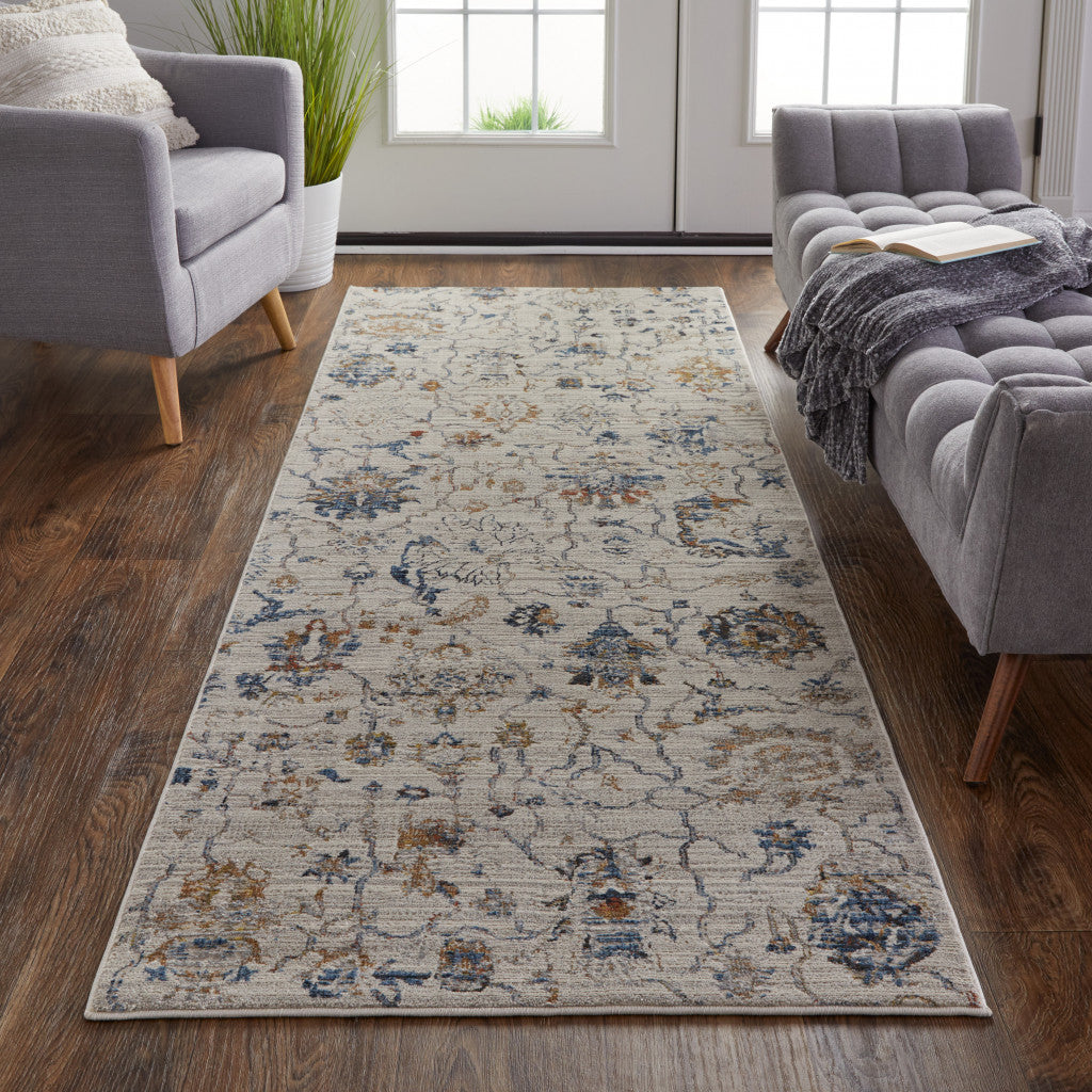 8' X 10' Ivory Orange And Blue Floral Power Loom Distressed Area Rug With Fringe