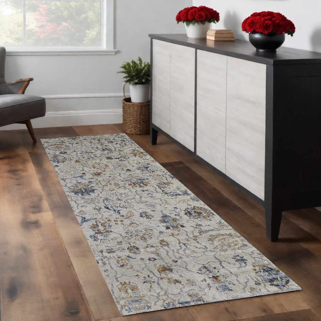 8' X 10' Ivory Orange And Blue Floral Power Loom Distressed Area Rug With Fringe