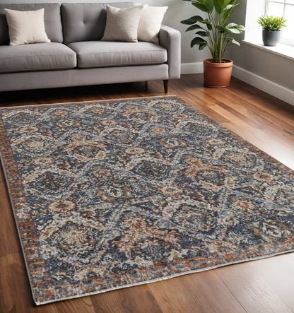 12' X 15' Ivory Blue And Burnt Orange Floral Area Rug With Fringe