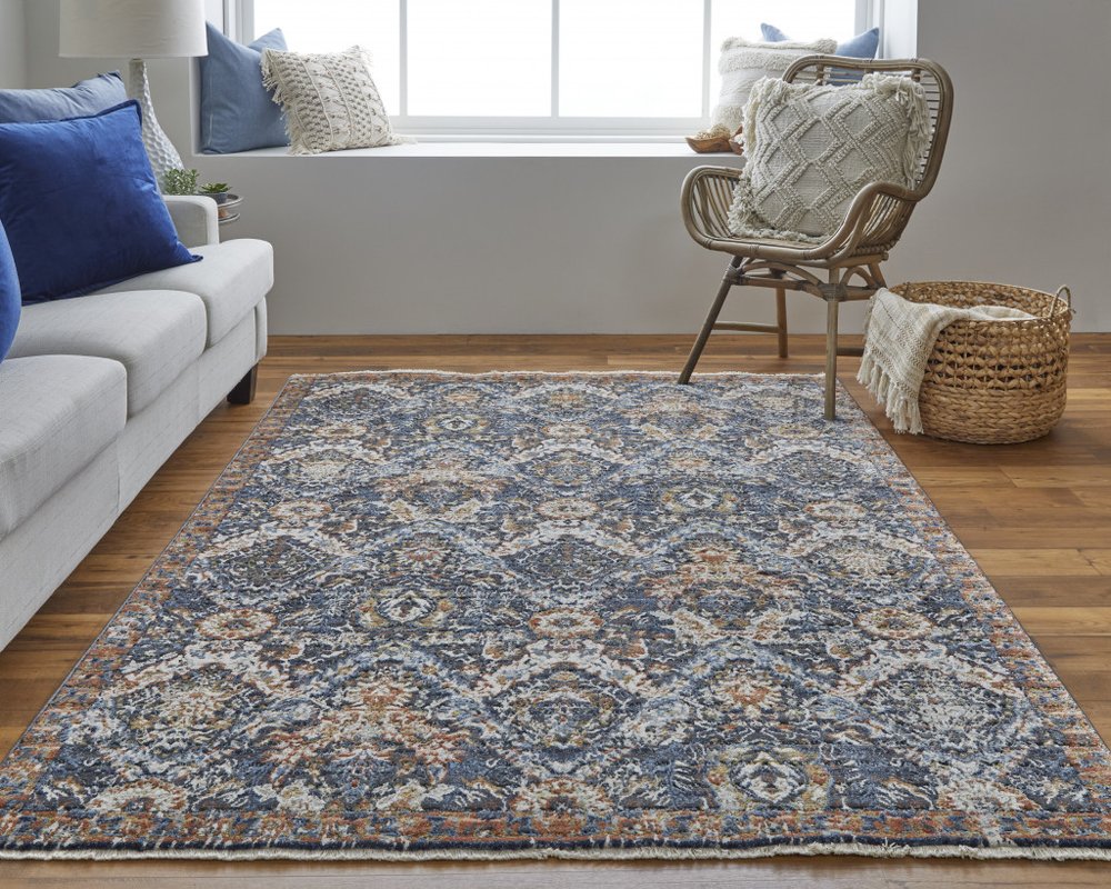 5' X 8' Ivory Blue And Burnt Orange Floral Area Rug With Fringe