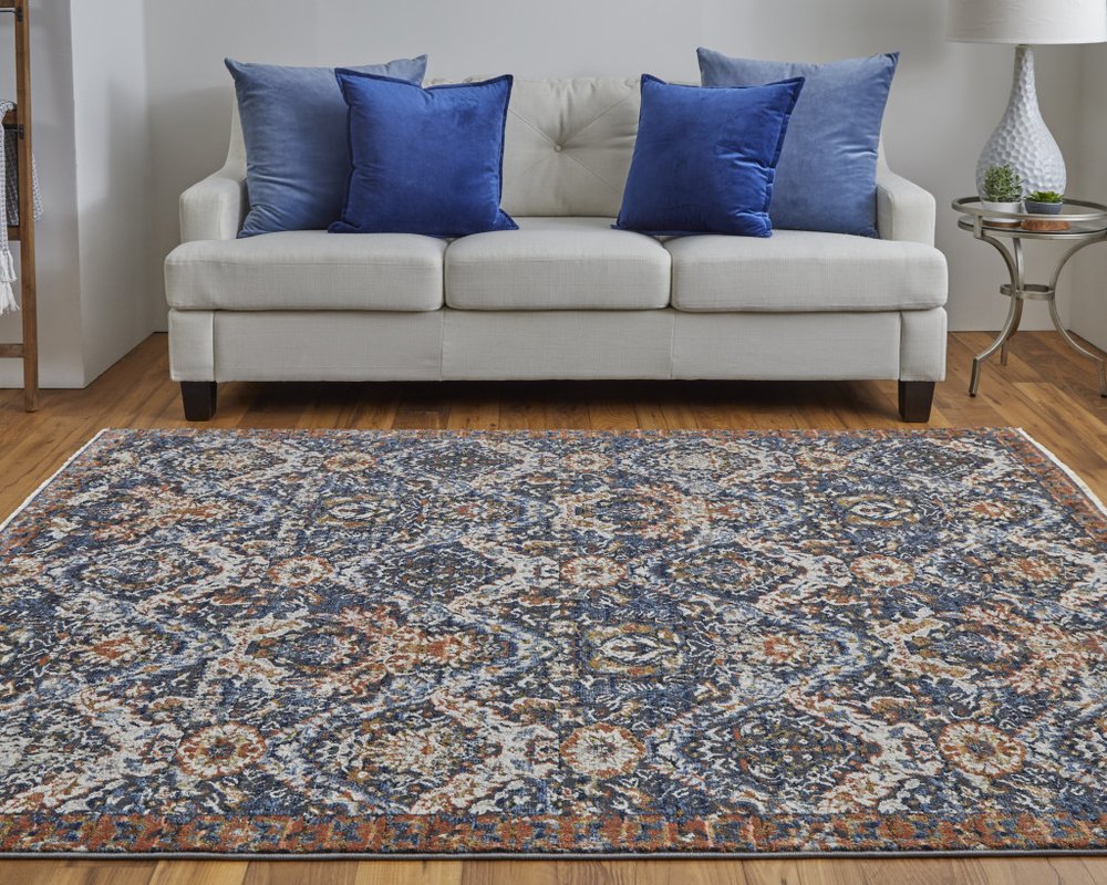 5' X 8' Ivory Blue And Burnt Orange Floral Area Rug With Fringe