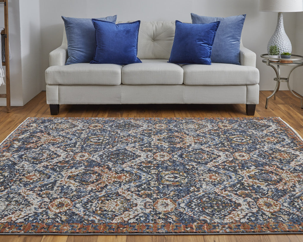 5' X 8' Blue Orange And Ivory Floral Power Loom Area Rug With Fringe