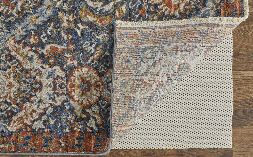 5' X 8' Blue Orange And Ivory Floral Power Loom Area Rug With Fringe