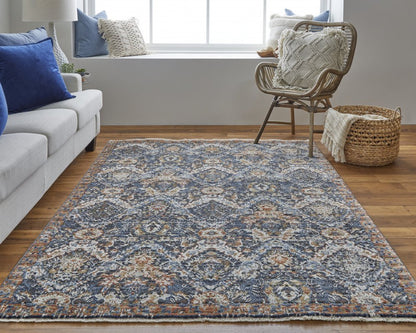 5' X 8' Ivory Blue And Burnt Orange Floral Area Rug With Fringe