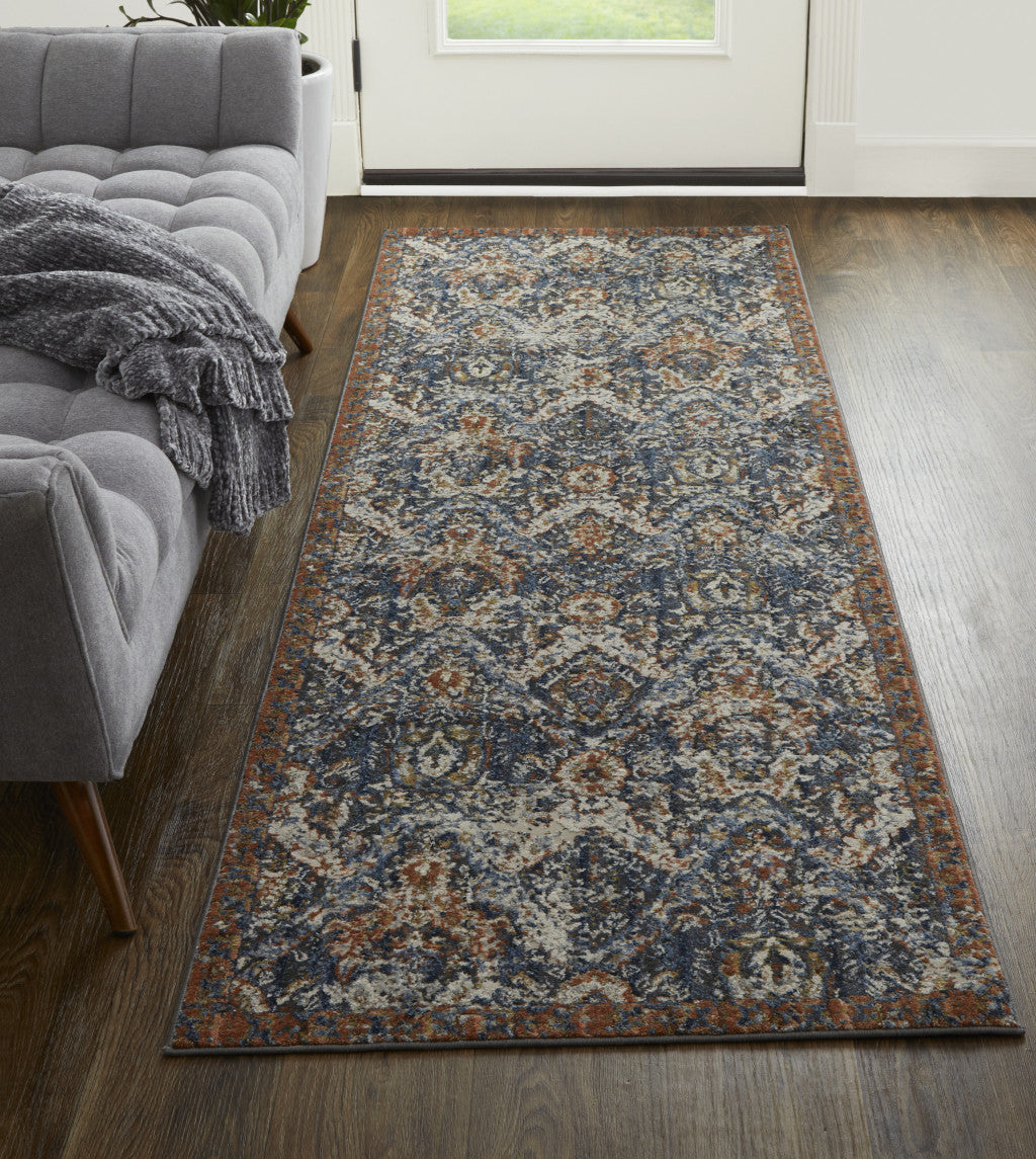 5' X 8' Blue Orange And Ivory Floral Power Loom Area Rug With Fringe