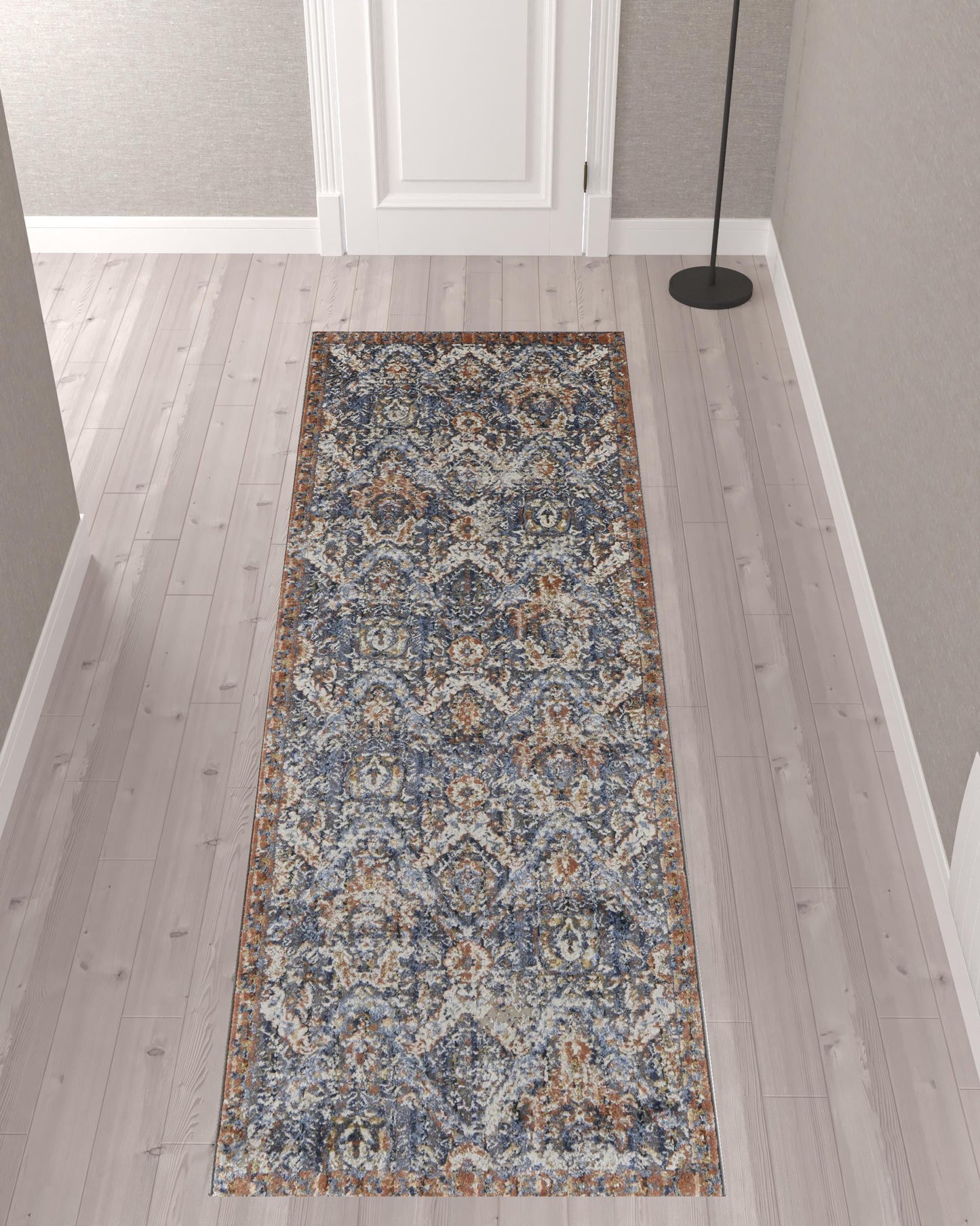 5' X 8' Blue Orange And Ivory Floral Power Loom Area Rug With Fringe
