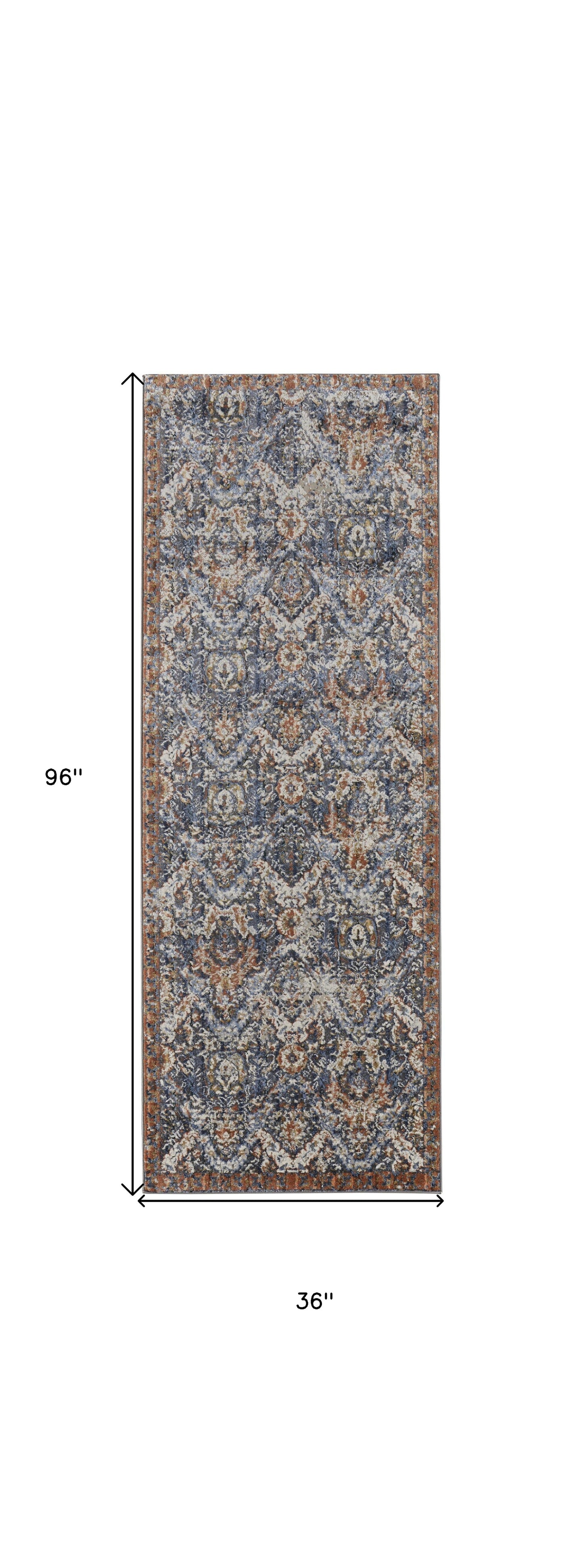 5' X 8' Blue Orange And Ivory Floral Power Loom Area Rug With Fringe