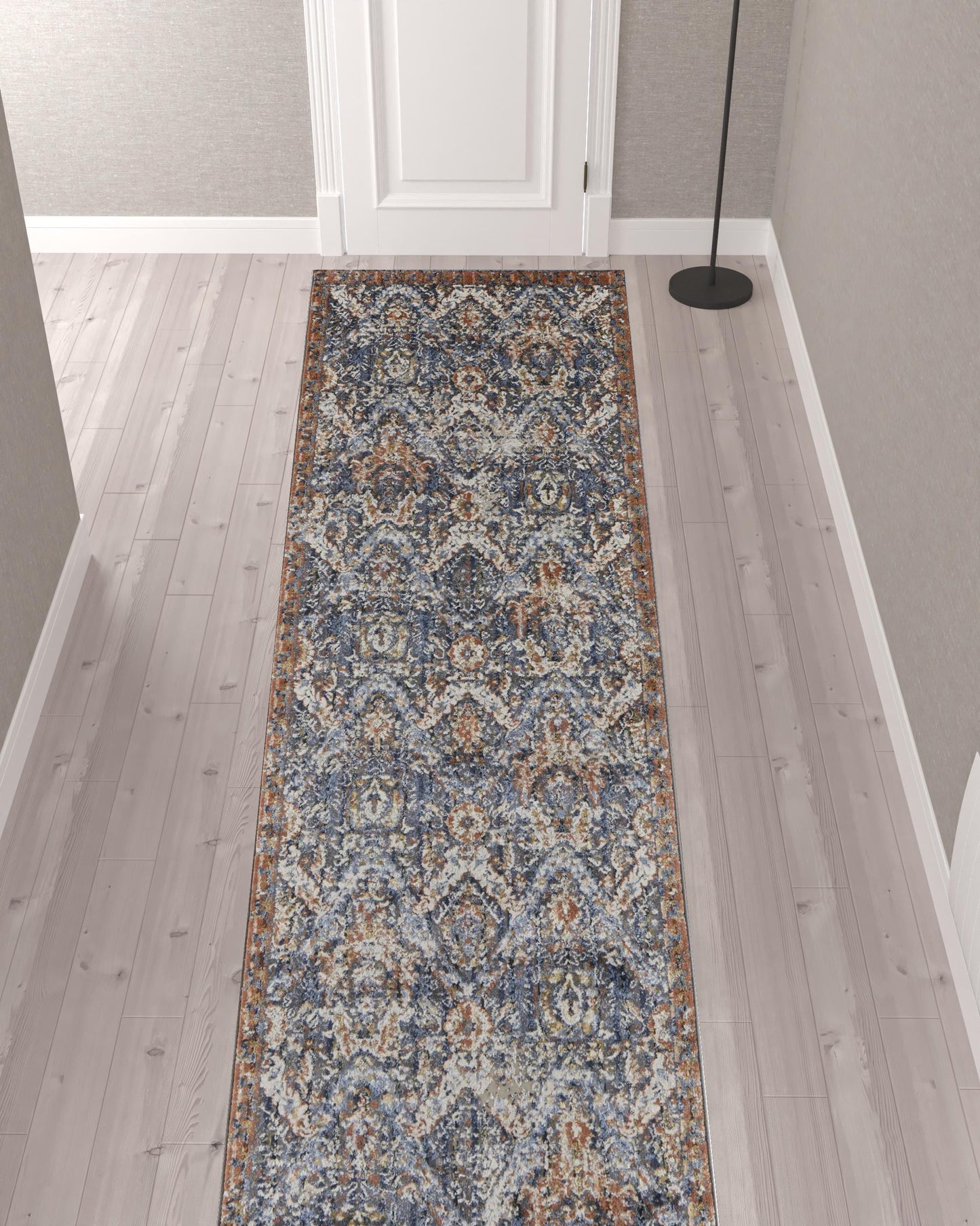 5' X 8' Blue Orange And Ivory Floral Power Loom Area Rug With Fringe