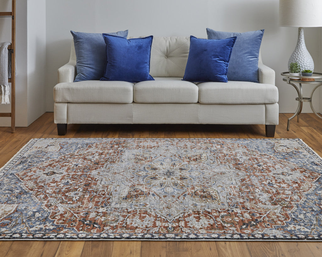 5' X 8' Orange Ivory And Blue Floral Power Loom Area Rug With Fringe