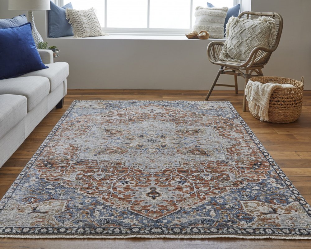 2' X 3' Burnt Orange Ivory And Blue Floral Area Rug With Fringe