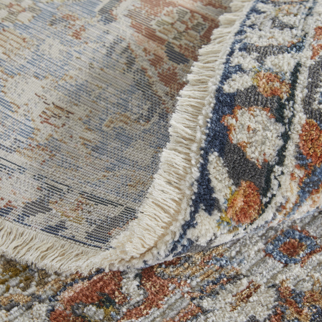 5' X 8' Orange Ivory And Blue Floral Power Loom Area Rug With Fringe