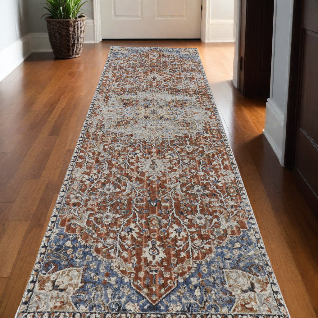 5' X 8' Orange Ivory And Blue Floral Power Loom Area Rug With Fringe