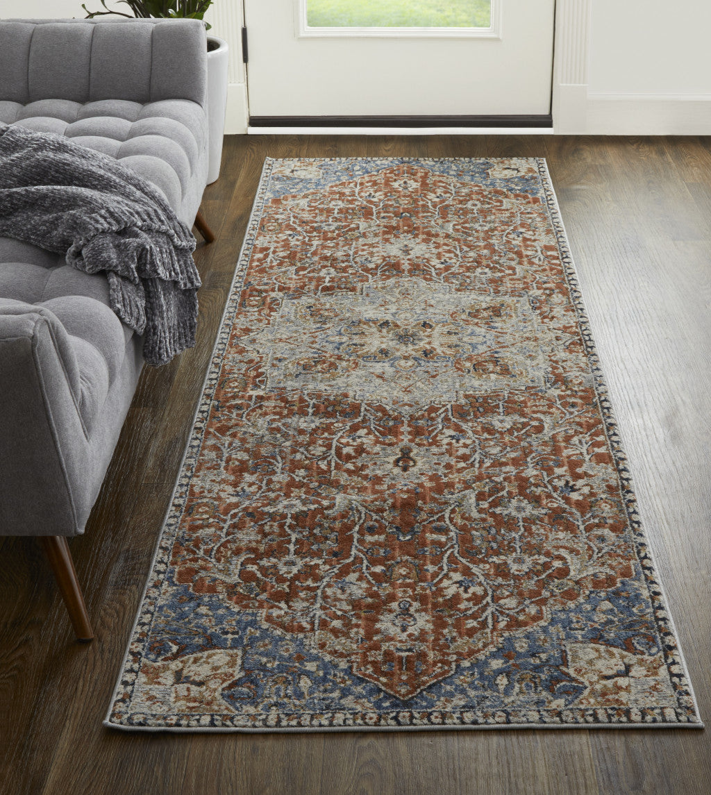 5' X 8' Orange Ivory And Blue Floral Power Loom Area Rug With Fringe