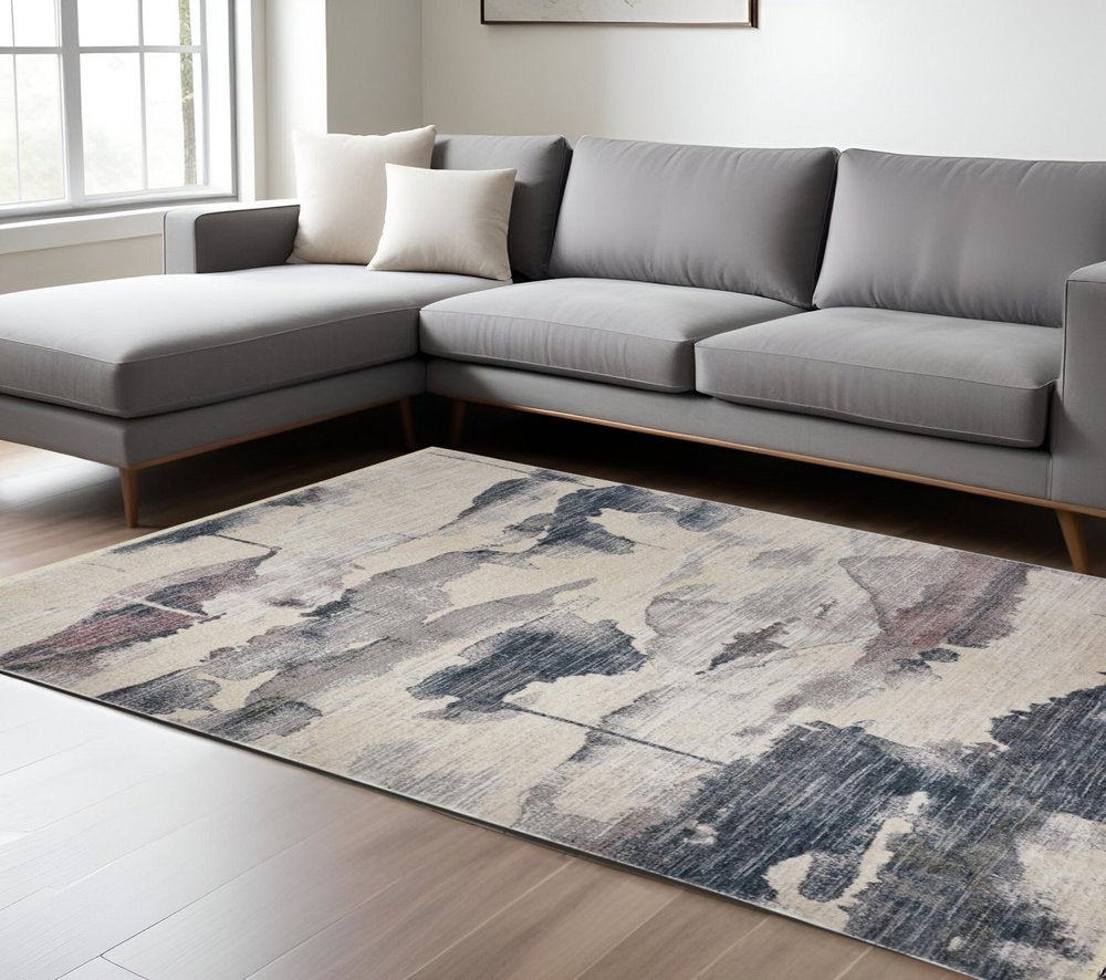9' X 13' Ivory Blue And Pink Abstract Stain Resistant Area Rug
