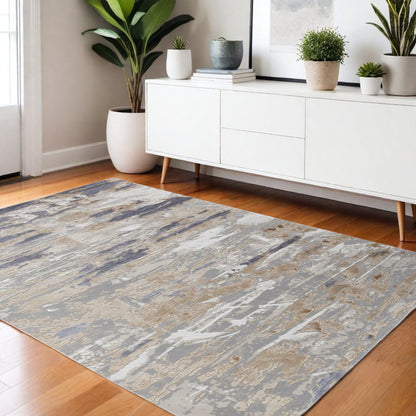 5' X 8' Tan Ivory And Blue Abstract Distressed Area Rug