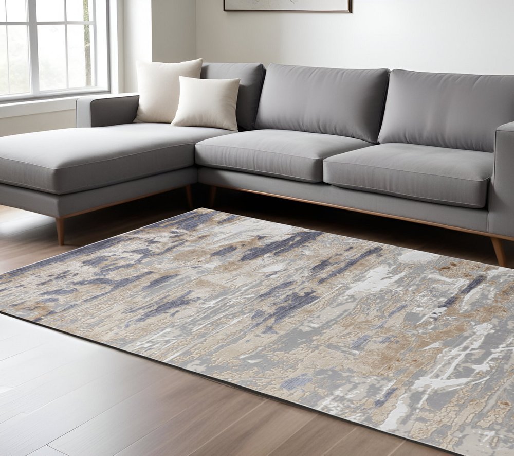 5' X 8' Tan Ivory And Blue Abstract Distressed Area Rug