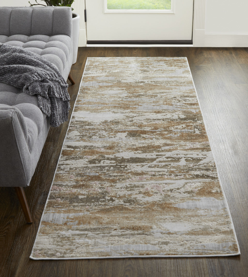 5' X 8' Tan Orange And Ivory Abstract Power Loom Distressed Area Rug