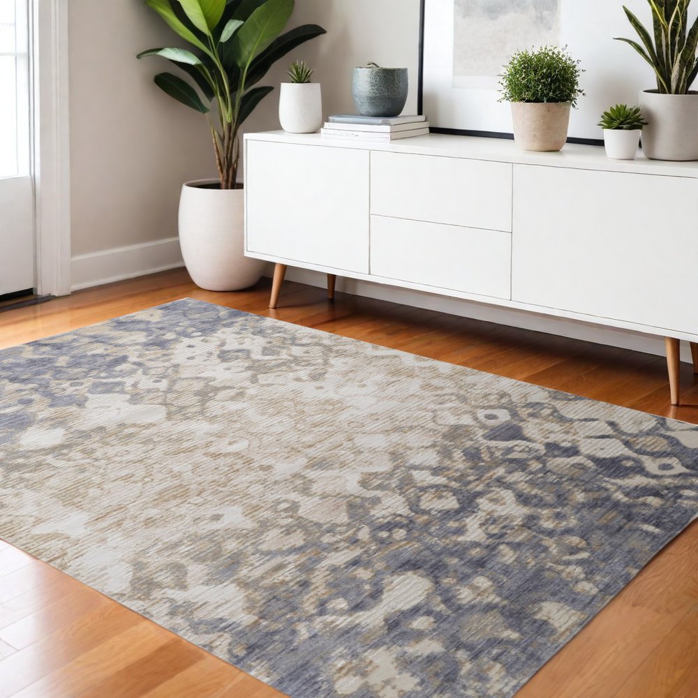 5' X 8' Ivory Tan And Blue Abstract Distressed Area Rug