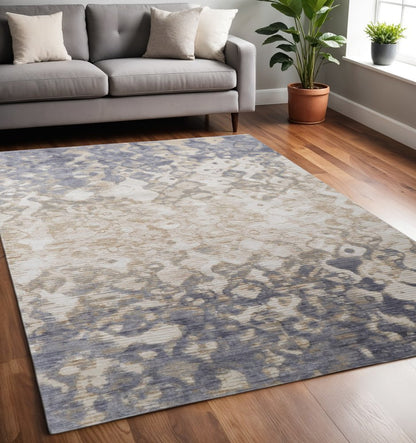 8' X 10' Ivory Tan And Blue Abstract Distressed Area Rug