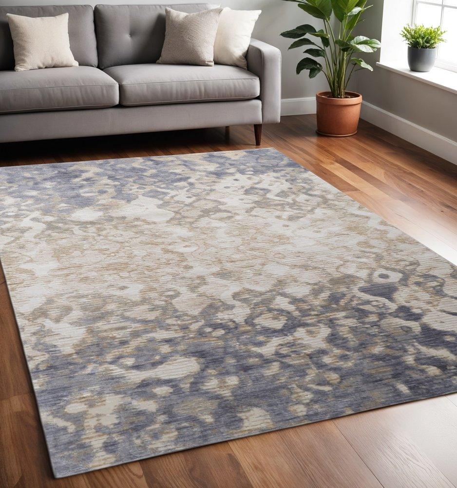 8' X 10' Ivory Tan And Blue Abstract Distressed Area Rug