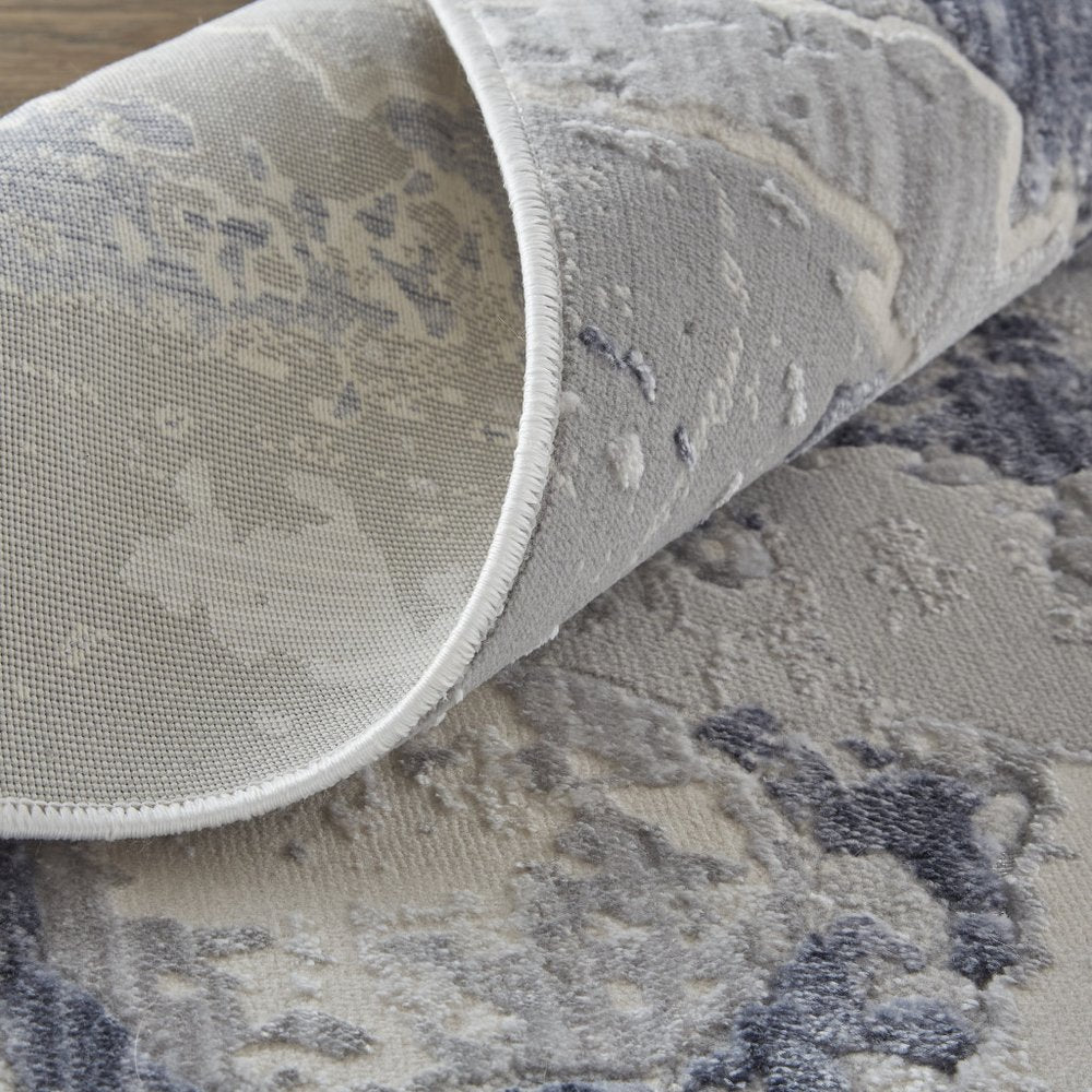 2' X 3' Ivory And Blue Abstract Power Loom Distressed Area Rug