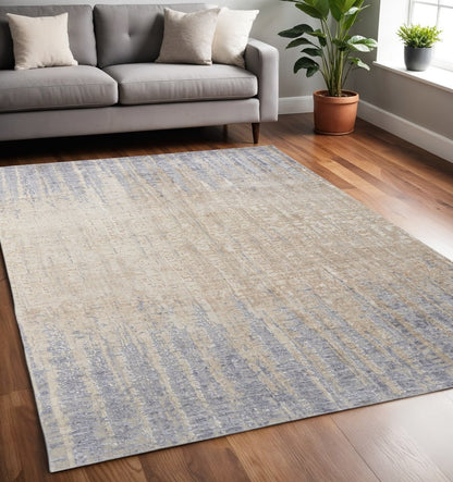 5' X 8' Tan And Blue Abstract Distressed Area Rug