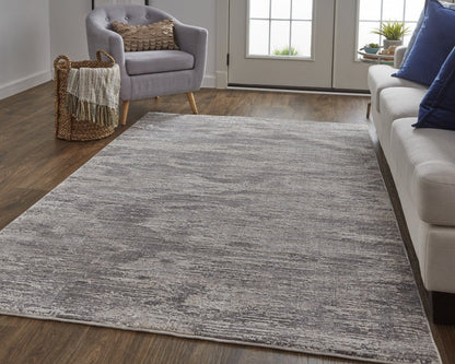 5' X 8' Tan And Gray Abstract Distressed Area Rug