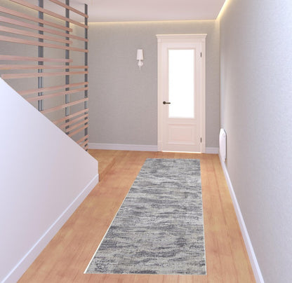 5' X 8' Tan And Gray Abstract Distressed Area Rug