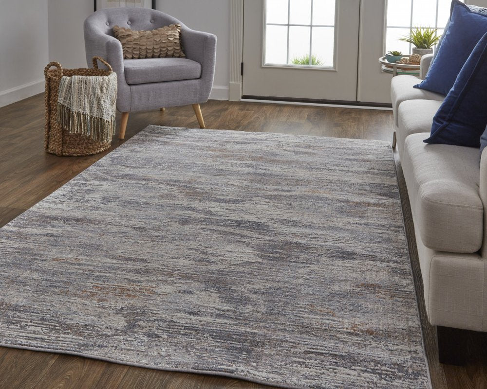 5' X 8' Tan And Gray Abstract Distressed Area Rug