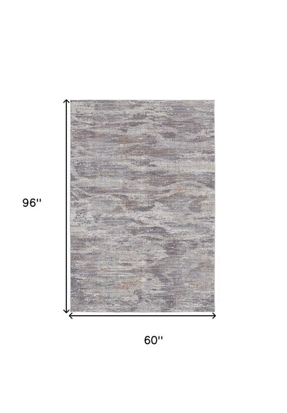 5' X 8' Tan And Gray Abstract Distressed Area Rug