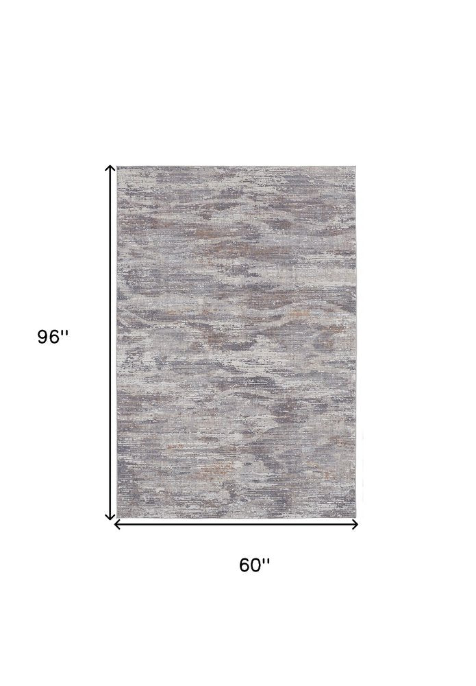 5' X 8' Tan And Gray Abstract Distressed Area Rug